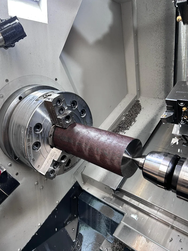 CNC milling machine working on metal workpiece machining lavorazioni-meccaniche-lecco